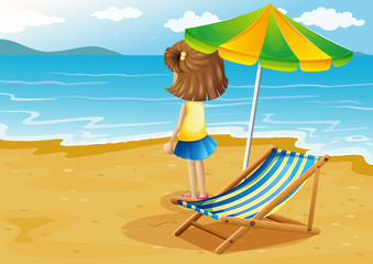 A girl at the beach with a foldable chair and an umbrella