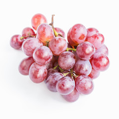 Red grapes on white background