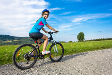 Fototapeta premium Healthy lifestyle - teenage girl biking