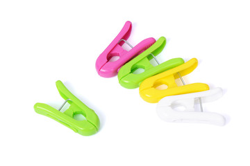 Closeup image of colorful clothespins on a white background