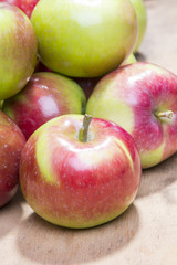 pile of apples on a wooden background