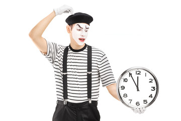 Mimic holding a clock and thinking