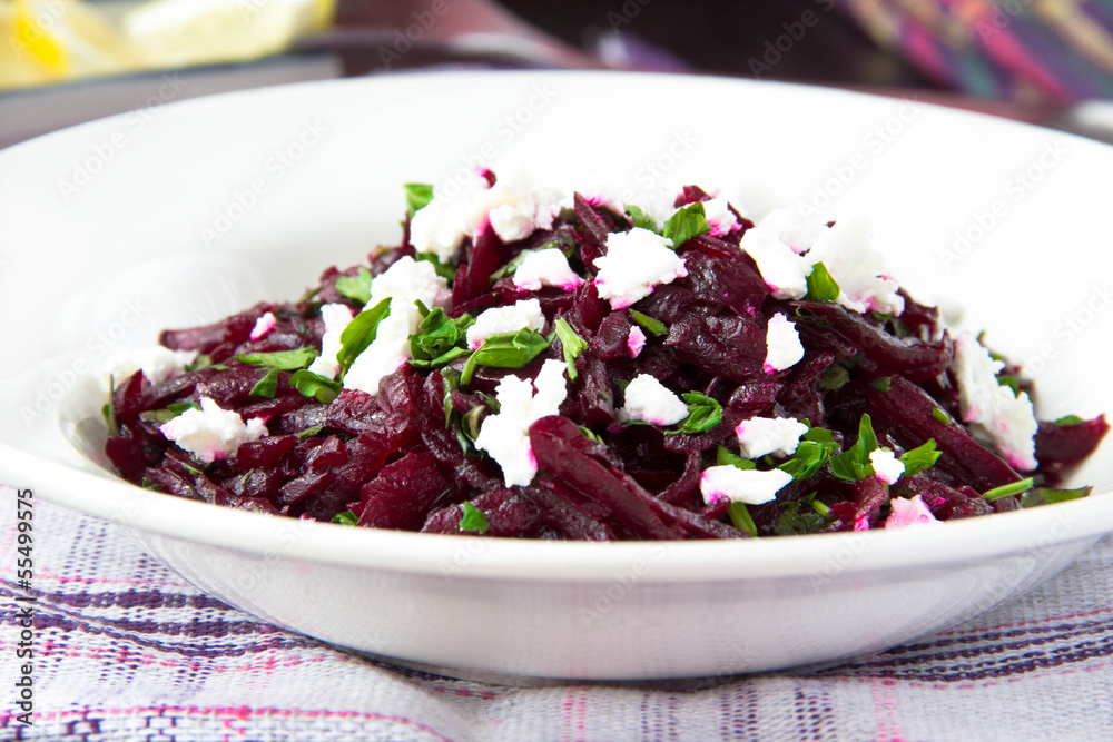 Wall mural delicious healthy beetroot salad with feta cheese and parsley