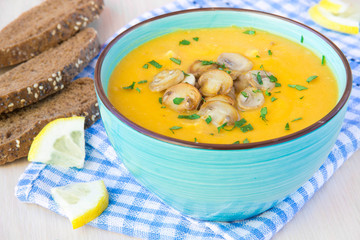 Fresh warm autumn soup with mushrooms champignon