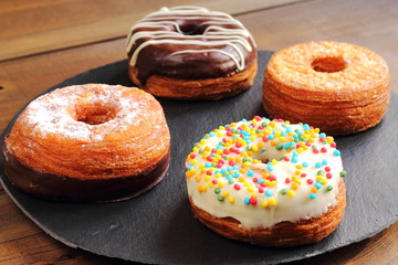 Fashionable puff pastries, half croissant and half donut