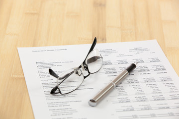 Financial report with calculator on table