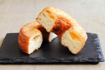 Fashionable puff pastry, half croissant and half doughnut