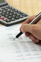 Financial report with calculator on table