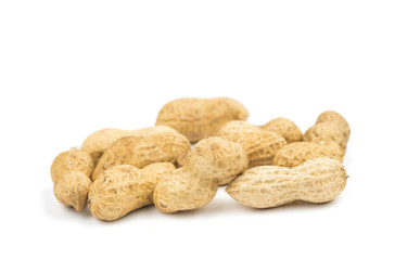 Close-up few peanuts isolated