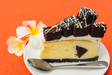 A piece of brownie cheesecake
