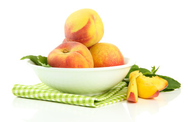 Ripe sweet peaches in bowl, isolated on white