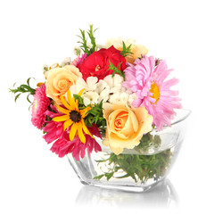Beautiful bouquet of bright flowers in glass vase, isolated