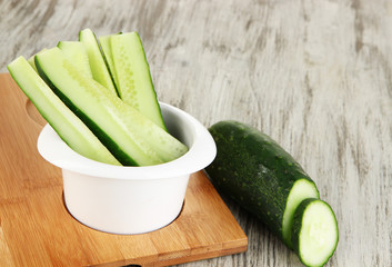 Bright fresh cucumber cut up slices in bowl