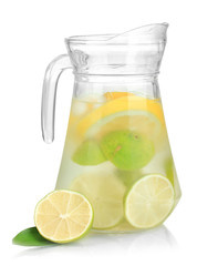 Cold water with lime, lemon and ice in pitcher isolated on