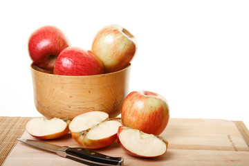 Apples in Bowl and Cut on Cutting Board