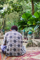 Thai muslim man in graveyard