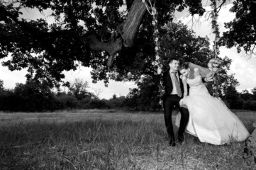 Groom and  bride on green glade