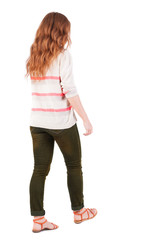 back view of walking  woman