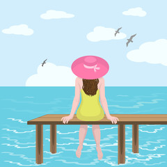 Girl in hat and sea