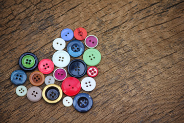 Heart of old colorful buttons