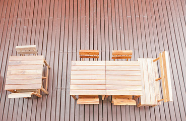 Dining wooden table and chairs in the outdoors. top view