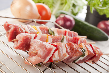 Raw shashlik and vegetables