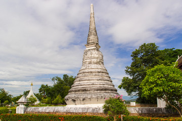 white pagoda in cloudy sky