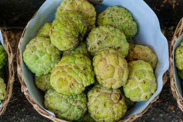 Sugar apple fruit in wicker basket prepare to sell in market