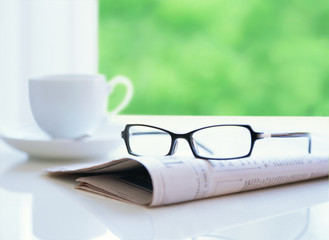 newspaper and glasses