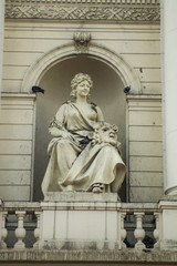 Statue of a woman with theatrical mask Lviv Ukraine