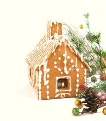 Gingerbread house with Christmas decoration isolated on white ba