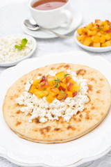 Flat bread with cottage cheese, honey, fresh peaches