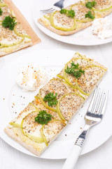 piece of cake with zucchini and yoghurt sauce, vertical