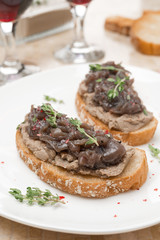 toast with liver pate and caramelized red onion on the plate