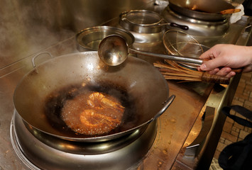 Prawns being fried in wok