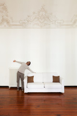 interior home, comfortable white sofa with man