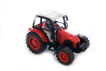 Tractor red toy on white
