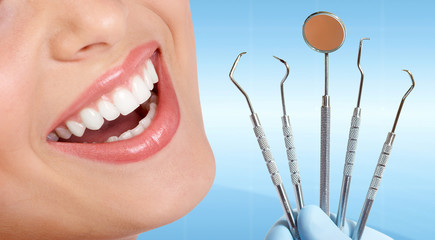 Teeth with dental tools.