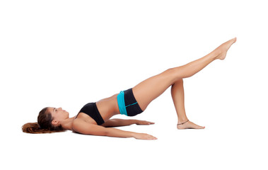Attractive woman doing pilates exercises