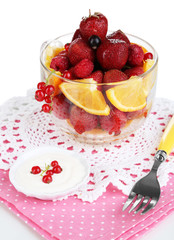 Useful fruit salad in glass cup isolated on white