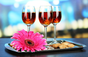 Glasses of amaretto liquor and roasted almonds,