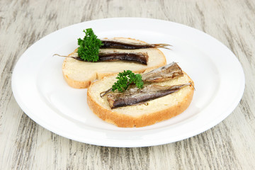 Tasty sandwiches with sardines, close-up