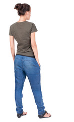 back view of standing young beautiful  brunette woman.
