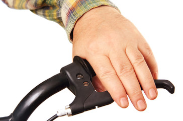 man's hand on the handlebars.