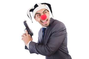 Businessman clown with gun isolated on white