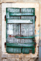 Old green wooden window blinds