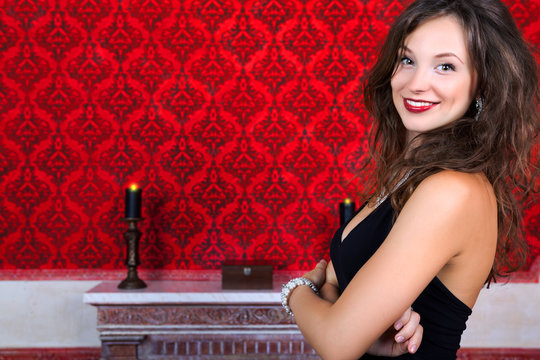 Sensual glamour girl on red vintage background