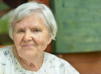 Senior woman on the veranda of his home.