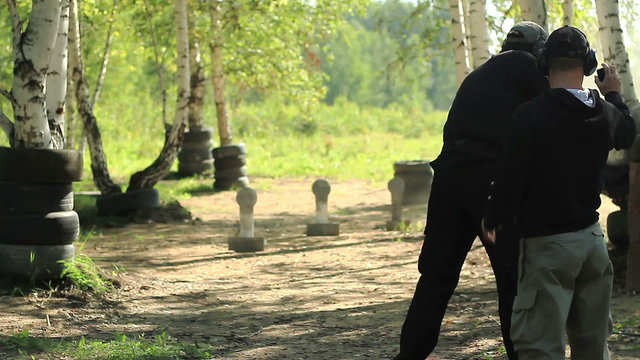 Man shoots at targets on the shooting competition of weapons