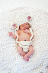 Newborn Baby Wearing a Lamb Costume © katrinaelena